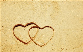 Two love hearts on the sand HD wallpaper