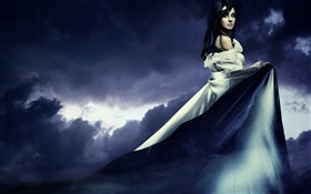 Beautiful girl in the dusk, long dress