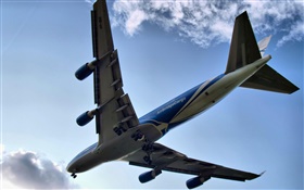 Boeing 747 aircraft flying, bottom view