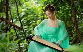 Green dress Asian girl playing the zither HD wallpaper