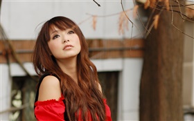 Red dress Asian girl in the autumn