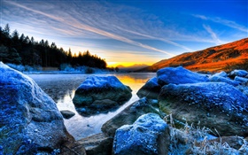 Stones, sunset, trees, volcanic lake