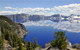 Volcanic lake, clouds, trees, water reflection
