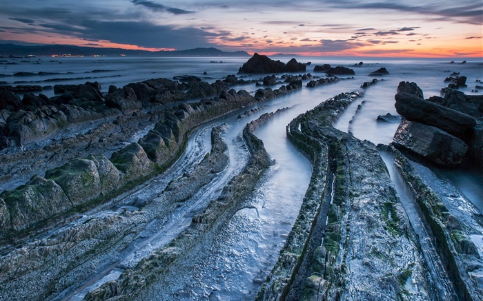 Coast, sunset, sea, shore, rocks, stones Wallpapers Pictures Photos Images