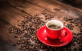 Coffee beans, red cup, saucer, steam