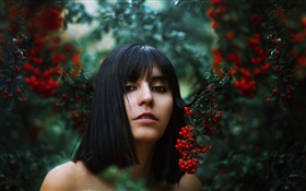Black hair girl, red berries, bokeh