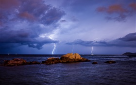 Sea, lightning, storm, stones, night, clouds HD wallpaper