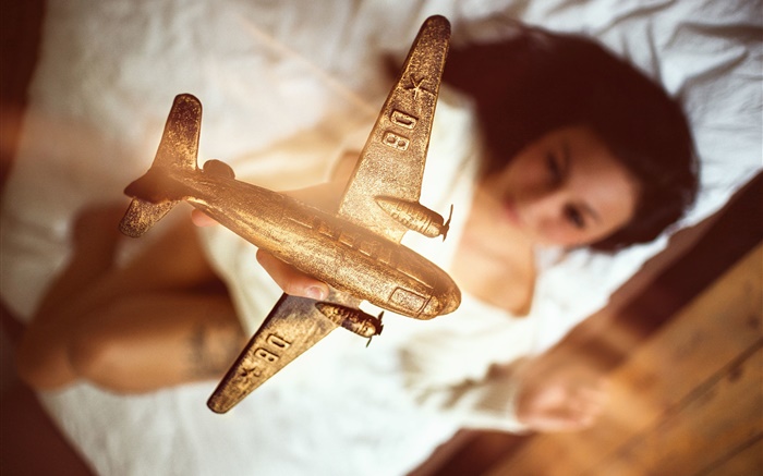Airplane model, golden, girl Wallpapers Pictures Photos Images