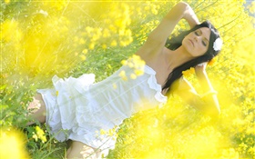 Canola flower field girl, white dress