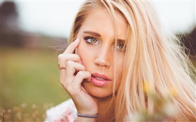 Yellow eyes girl, blonde, face, hand HD wallpaper
