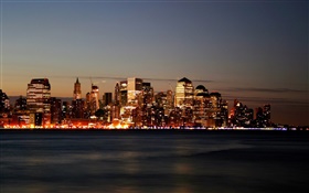 City skyscrapers, lights, night, river, water