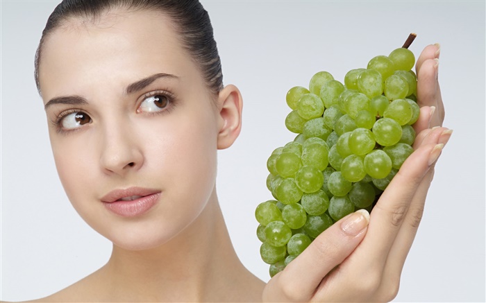 Girl with green grapes Wallpapers Pictures Photos Images