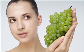 Girl with green grapes HD wallpaper