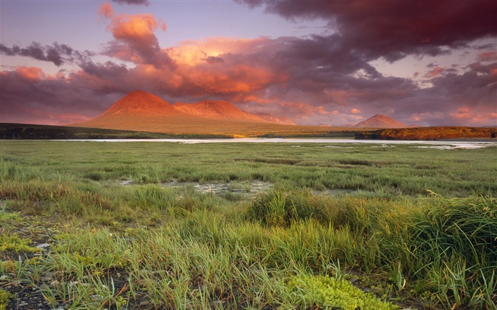 Grass, mountains, clouds, red sky, dusk Wallpapers Pictures Photos Images