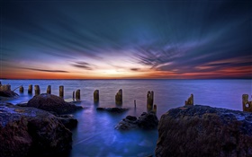 Ocean, coast, sea, fence, rocks, dawn HD wallpaper