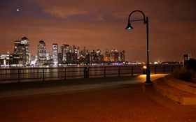 Skyscrapers, river, lights, city, street, lamps
