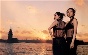 Two Asian girl, sunset, river, wind