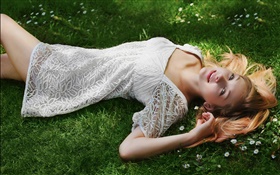 Beautiful girl lying grass, white dress, posture