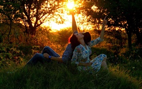 Man and woman, lovers, sun, meadow, forest