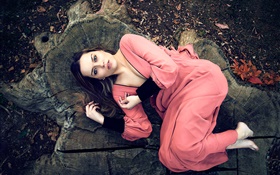 Pink dress girl lying on stump HD wallpaper