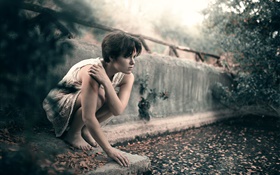 Short hair girl, sits, leaves, blur background HD wallpaper