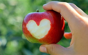 Red apple, love hearts, hand